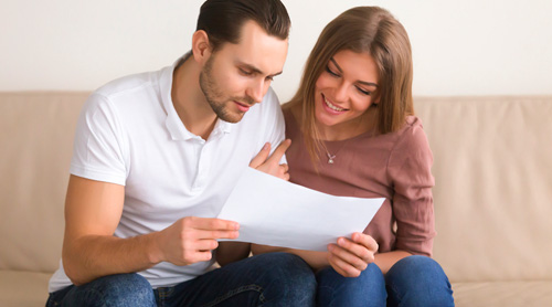 Couple discussing moving insurance.