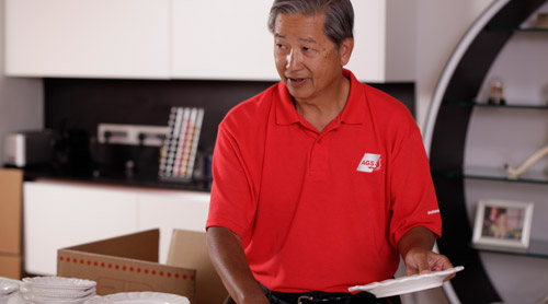 AGS Movers New Delhi staff carefully packing fragile items for relocation